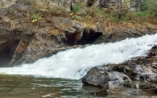 River gorge and towering rock face at Syntheri Rocks near Dandeli