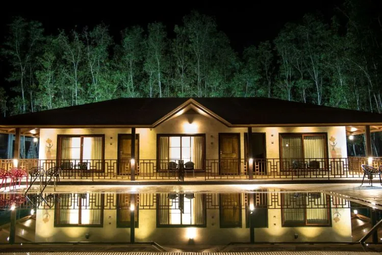 Pool-facing cottages at Dew Drops Resort Dandeli