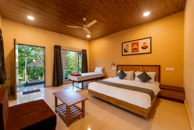 Deluxe cottage bedroom at Jungle View Cottage Dandeli