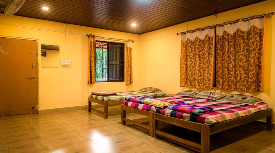 Open dining pavilion with tables and table tennis at Pepper Paradise Homestay Dandeli