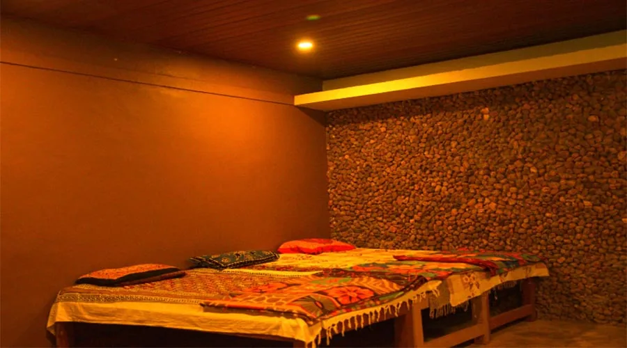 Rustic dormitory-style beds at Rangers Camp Dandeli