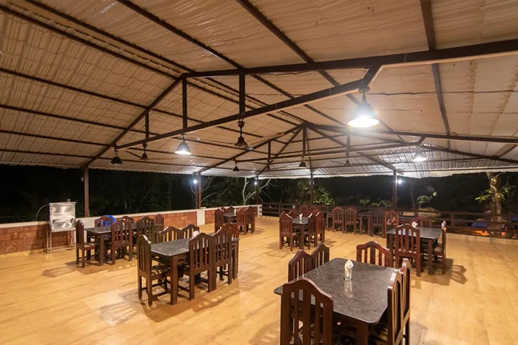 Open-air dining hall at Tusker Trails Resort Dandeli